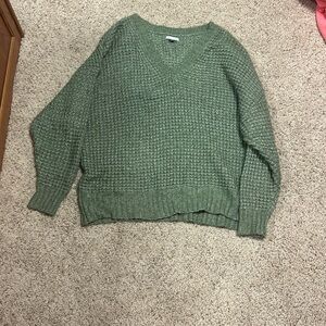 This American eagle sweater is a size XL and it’s a nice green color